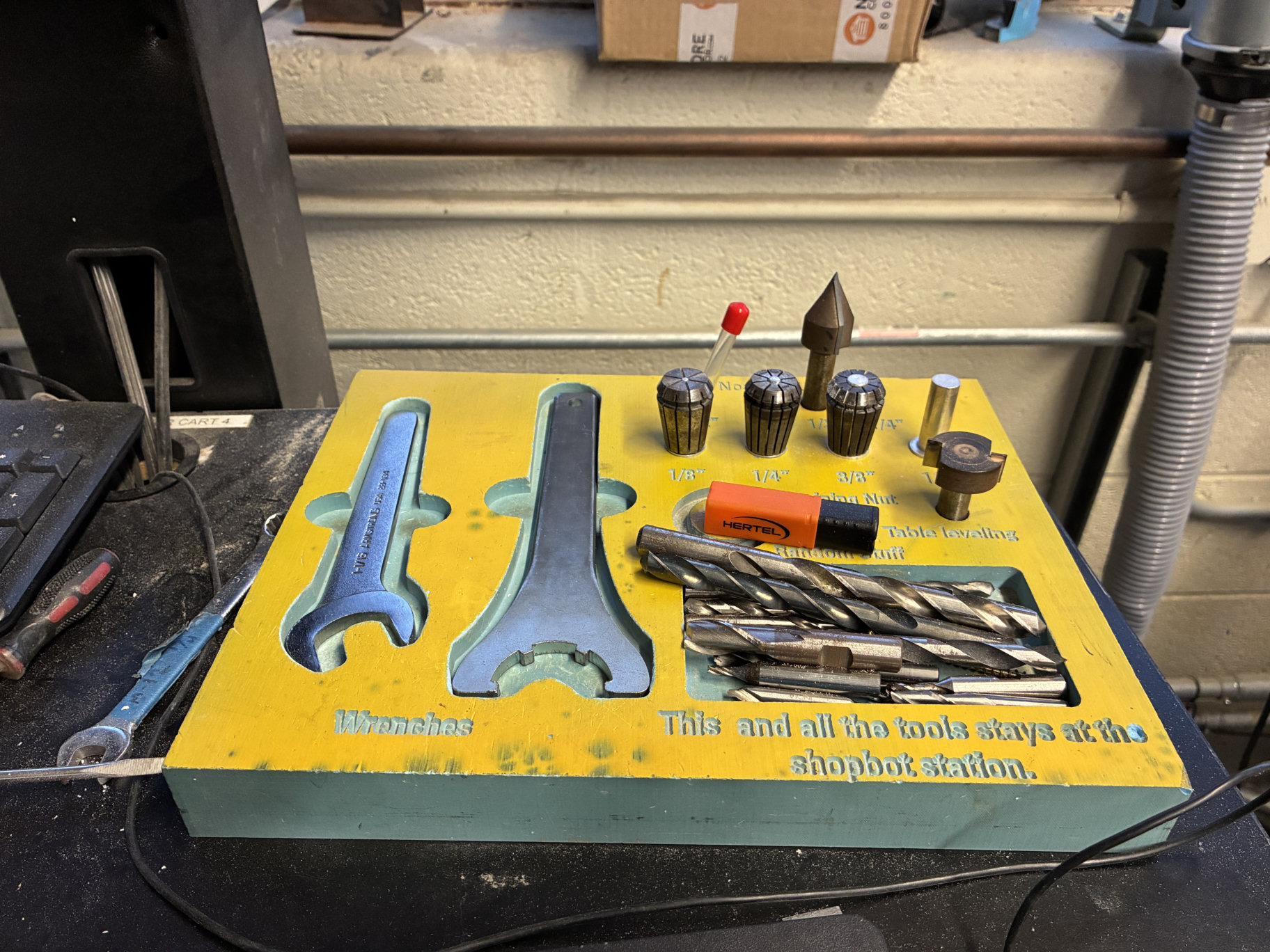 Collets, wrenches, and cutters at the ShopBot station